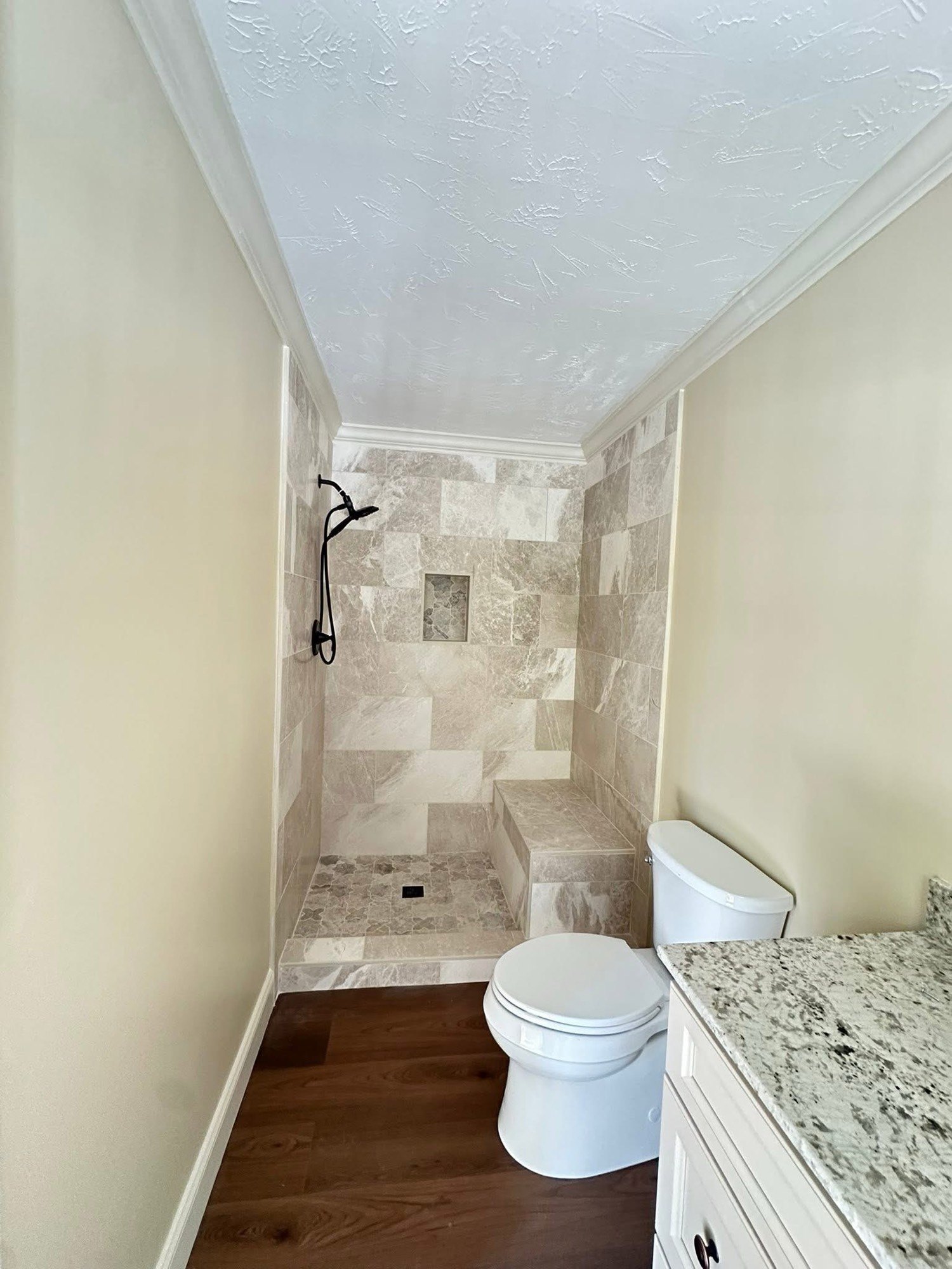 Bathroom after walk-in tile shower and new vanity