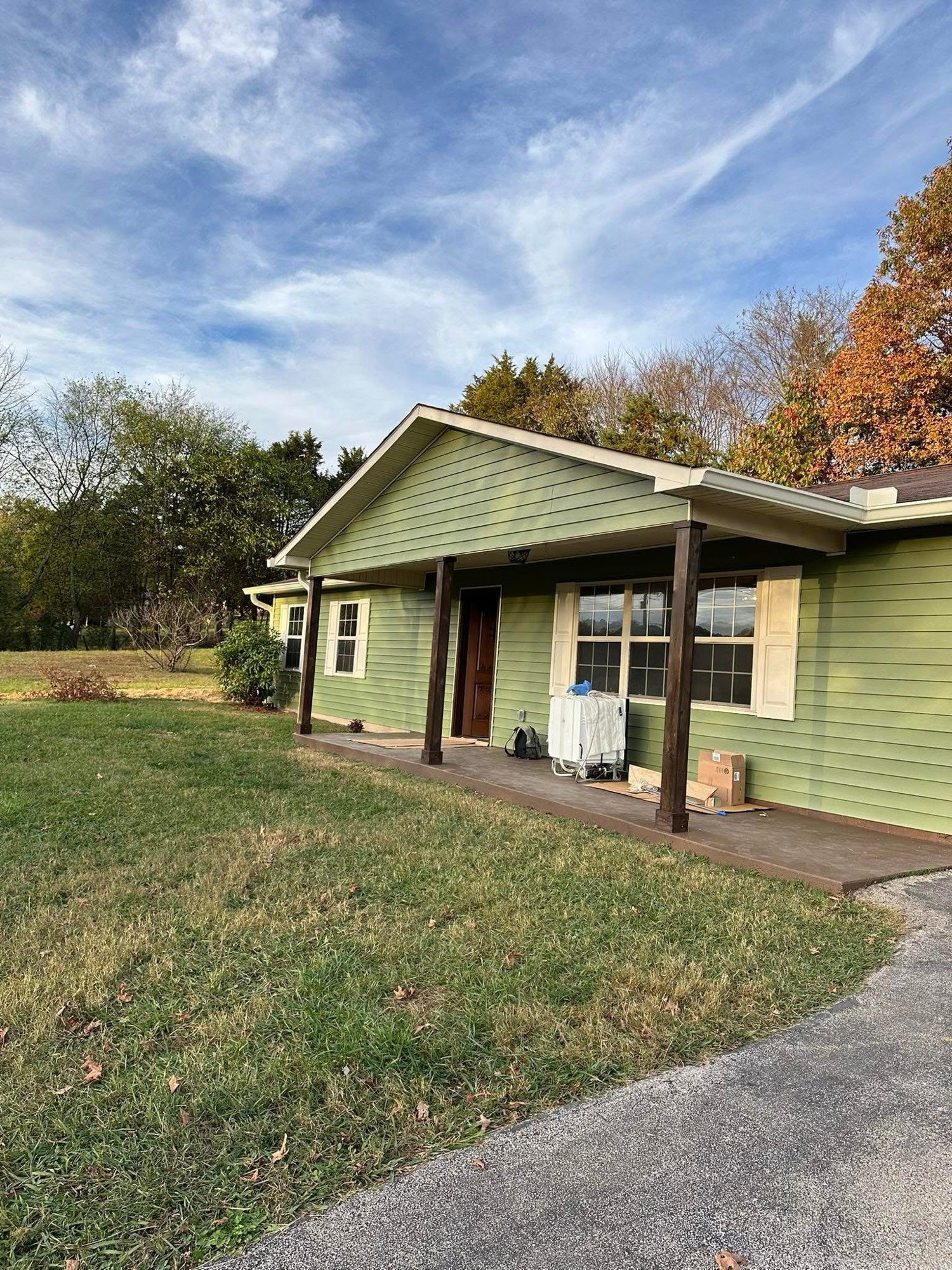 Ranch house after sage green exterior paint